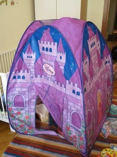 a child's play tent in the shape of a castle