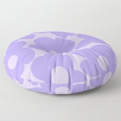 a purple and white flower pattern floor pillow