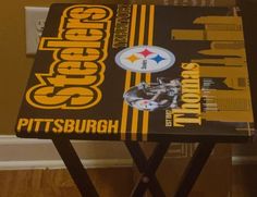 the pittsburgh football team logo is on this small table