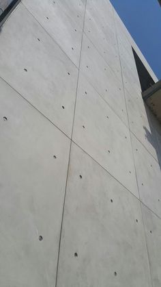 the side of a building that has holes in it