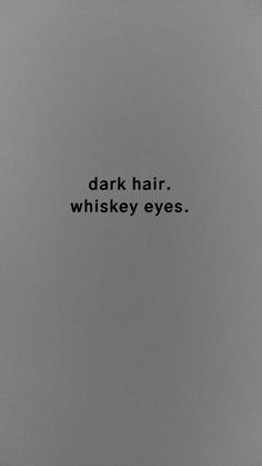 a black and white photo with the words dark hair whiskey eyes