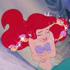 ariel from the little mermaid with her hair blowing in the wind and bubbles coming out