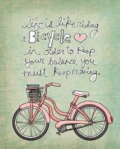 a pink bicycle with the words life is like riding a bicycle in order to keep your balance