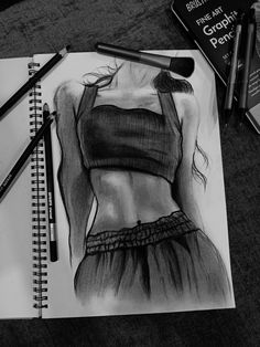 a pencil drawing of a woman's torso in black and white, next to some books