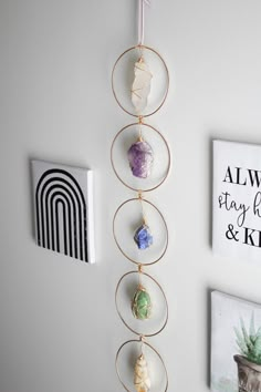 a wall hanging on the side of a white wall