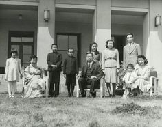 an old black and white photo of people in front of a building