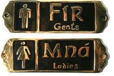 two black and gold metal signs with men and women symbols on them that say,'frr gents man ladies '