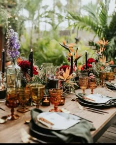 the table is set with plates and glasses