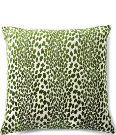 a green and white animal print pillow on a white background with the word's name in