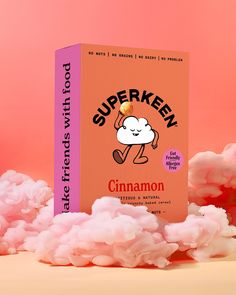 a box of cinnamon sitting on top of pink cotton balls with the words, superkev