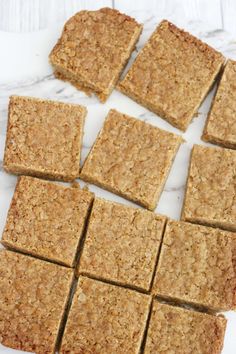 several squares of food sitting on top of a white counter