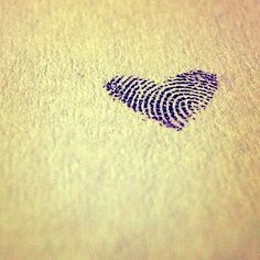 a fingerprint is on the ground next to a heart