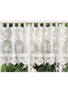 white lace curtain with flowers in the background