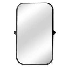 a mirror that is sitting on top of a wall mounted shelf with a black frame