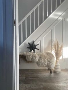 a white staircase with a black star on it and a quote from the book home decor such as your spirits and create sense of well being