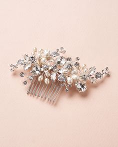 Add a subtle pop of floral beauty to your wedding hair with our Audra Pearl & Crystal Comb. Hand wired with freshwater pearl clusters, delicate florals & crystals that shimmer from all angles, Audra is perfect for your walk down the aisle. Made with crystal gemstones and freshwater pearls. Measures 4 x 2 inches. Metal comb is wired to the back of the design. Versatile & flexible, this piece can be worn in nearly any hairstyle. Style # 2453 Boho Wedding Hair Accessories, Floral Bridal Comb, Pearl Bridal Comb, Pearl Comb, Crystal Comb, Wedding Comb, Floral Comb, Crystal Hair Clips, Metal Comb