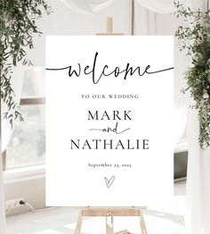 a welcome sign with the words mark and natalie written in cursive font on it