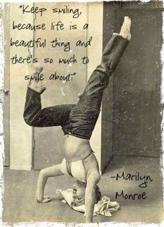 a man doing a handstand on the floor with a quote above it that reads keep smiling because life is a beautiful thing and there's so much to smile about