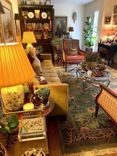 a living room filled with lots of furniture and decor