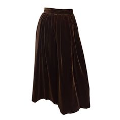 Beautiful, and a fall / winter must! Vintage Yves Saint Laurent Rive Gauche 1970s HIGH WAISTED brown velvet midi (calf length) skirt! Goes with virtually any style/color top. POCKETS at each side of the hips. Great with a pop of color, yet sophisticated paired with black. Luxurious, soft velvet, that is so comfortable, yet effortlessly chic. Side metal zipper, with large hook-and-eye closure. Fully lined. In great condition. Made in France. Marked Size EU 36 (Approximately Size Small) Measuremen Chocolate Brown Skirt, Brown Velvet Skirt, Skirts Brown, Velvet Midi Skirt, Vintage Chocolate, Mid Calf Skirt, Full Midi Skirt, Chiffon Maxi Skirt, Evening Skirts