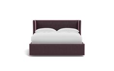 an upholstered bed with white sheets and purple headboard, in front of a white background