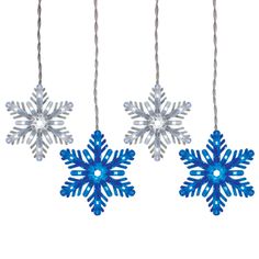 three blue snowflakes hanging from strings