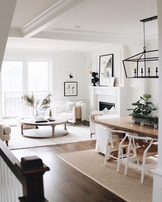 the kitchen is clean and ready to be used for cooking or dining room furniture, as well as potted plants