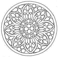 a circular stained glass design in black and white