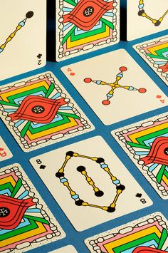 several playing cards with different designs on them