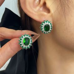 ✰ This delicate lab-created green jewelry is perfect for people who want to achieve a brilliant and splendid look ✰ This oval stud earrings not only suitable for formal occasions such as banquets, weddings, theme parties, but also for everyday wear ✰ This dainty earrings is a very special gift for birthday, Mother's Day, Valentine's Day and more  ✰ Comes with an exquisite gift box We also offer the necklace and ring from the same collection: https://www.etsy.com/listing/1229240980/green-oval-ring-with-halo-green-cz-ring https://www.etsy.com/listing/1242071869/green-oval-pendant-with-halo-green Materials: Environmentally-friendly brass Needle Materials: Silver Quantity: 1 Pair Earring Size: 0.72 x 0.66 in Main Gem Stone Size: 0.37 x 0.28 in ----♛ PRODUCTION & SHIPPING ♛ --- ✰Multiple items Green Cubic Zirconia Oval Earrings, Green Oval Cubic Zirconia Earrings, Oval Green Cubic Zirconia Earrings, Elegant Green Earrings With Halo Setting, Elegant Green Earrings With Halo Design, Green Halo Jewelry For Gift, Green Round Earrings With Halo Setting, Green Oval Earrings For Anniversary, Oval May Birthstone Earrings