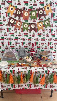 a table covered in lots of food and decorations