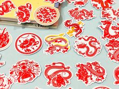 many red and white stickers on a table