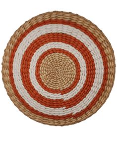 an orange, white and brown basket with circles on the bottom is isolated against a white background