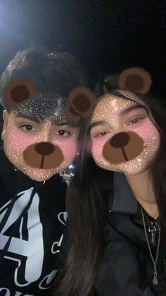 two people with fake teddy bears on their faces