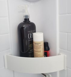 the bathroom shelf is organized with products such as shampoo, lotion and deodorant