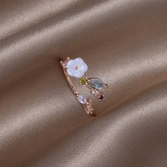 Bloom, blossom, and grow! Designed to capture the beauty of a blooming flower, this ring is a must-have. Rings Rose Gold, White Blossom, Bloom Blossom, Crystal White, Black Gift Boxes, White Crystal, Blooming Flowers, White Rose Gold, White Ring