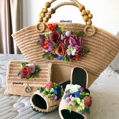 a straw bag with flowers on it and matching shoes