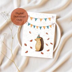 a card with an image of a hedgehog wearing a party hat on it's head