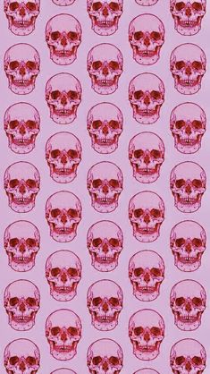 a pink background with red skulls on it