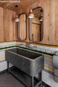 a bathroom with two sinks and mirrors in it