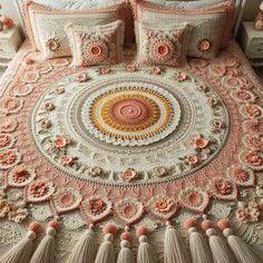 a crocheted bedspread with tassels and flowers on the bed