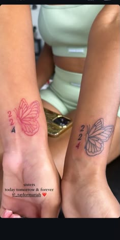 two girls with matching tattoos on their arms, one has a butterfly and the other has a number