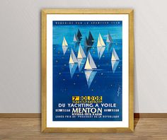 a framed poster on the wall shows sailboats floating in blue water and stars above them