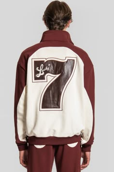 The Keiser Clark Lucky Number 7 Sweatshirt 1/4 Zip Pullover features a soft heavyweight burgundy and vintage white French terry body with a burgundy "Keiser Clark" retro logo embroidery on the left front chest and a vintage white denim back panel with a #7 burgundy leather appliqué and embroidery design on the rear of the jacket. The sweatshirt is constructed with a two front interior hand pockets, fold over collar, elasticated ribbed waistband and cuffs, tied together with a silvertone zipper f White French, Number 7, Half Zip Sweatshirt, Lucky Number, Retro Logo, 1/4 Zip Pullover, Hoodie Outfit, Zipper Hoodie, Logo Embroidery