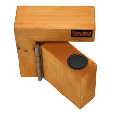 a wooden object with a speaker attached to it