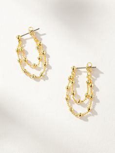 Add some edge to your ear stack with our Ball And Chain Earrings. These dangle earrings connect in the back to create a unique wrap around look. For the ultimate ear stack, pair these gold earrings with your favorite pair of stud earrings. Don’t forget to complete your look with our Ball Chain Necklace. | Gold Ball and Chain Dangle Earrings | Women's Jewelry by Uncommon James Elegant Gold Earrings With Double Chain, Gold Dangle Wrap Earrings In Dainty Style, Gold Dangle Wrap Earrings, Dainty Style, Gold Dainty Dangle Wrap Earrings, Dainty Gold Wrap Drop Earrings, Ball And Chain, Uncommon James, Ball Earrings, Earring Ideas