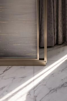 the corner of a room with marble flooring