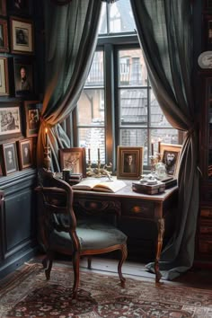 an old fashioned desk and chair in front of a window with pictures on the wall