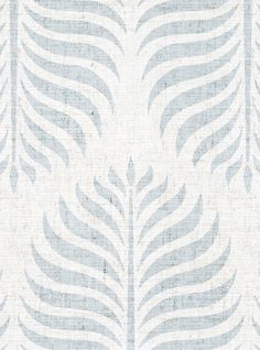 a blue and white wallpaper with leaves on it