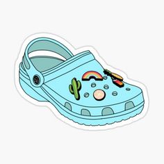 a blue crocs sticker with an image of a cactus and rainbow on it